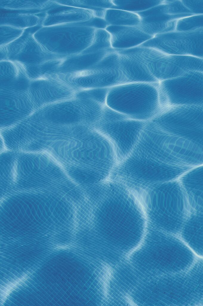 Close-up of clear blue swimming pool water (illustrative stock photo, not a Watermark job)